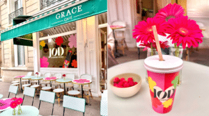 Façade du Grace Café à Paris décorée pour la collaboration JOD x Marine Vignes, avec une boisson rose et des fleurs