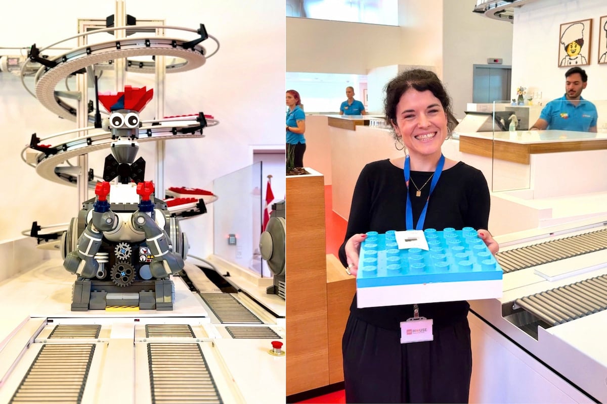 Robot du restaurant MINI CHEF à LEGO House et visiteuse tenant sa boîte de repas en forme de brique LEGO.